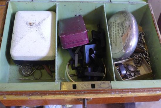 Silver tobacco squeeze box, 2 silver watch chains and other items in a tin box